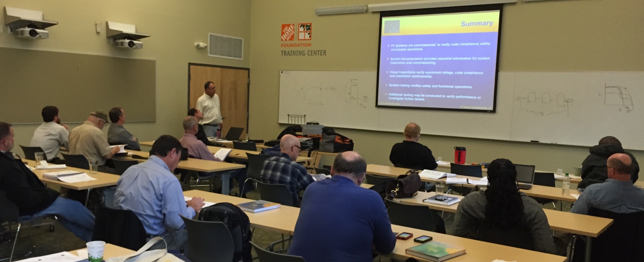 Participants attending a classroom solar training session